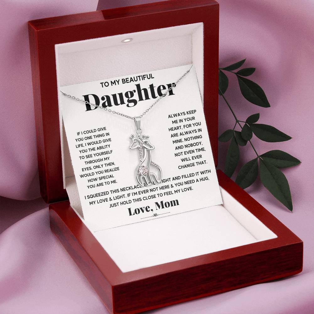 gift card with 2 giraffes intertwined necklace pendant necklace on it and