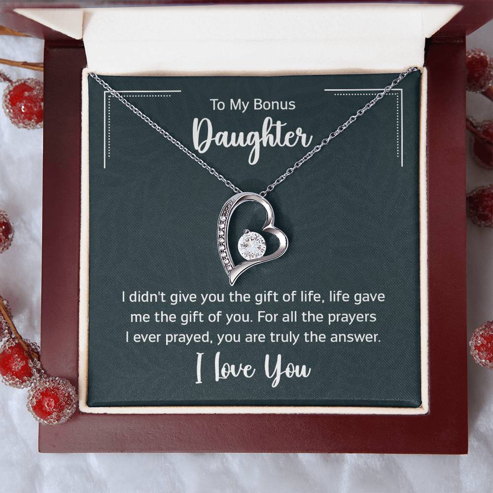 Gift box with a heart pendant necklace on It. 14k white gold finish or 18k yellow gold finish 6.5mm round cut cubic zirconia stone Pendant dimensions: 0.8" (2.2cm) height / 0.7" (1.8cm) width Adjustable chain length: 18" - 22" (45.72cm - 55.88cm) Lobster clasp attachment