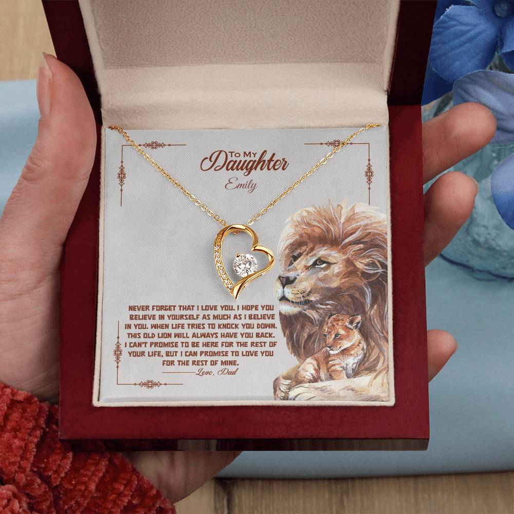 a gift box with a stainless steel heart shapped pedant necklace with a large cz diamond and small ca chip diamonds on the perimeter A