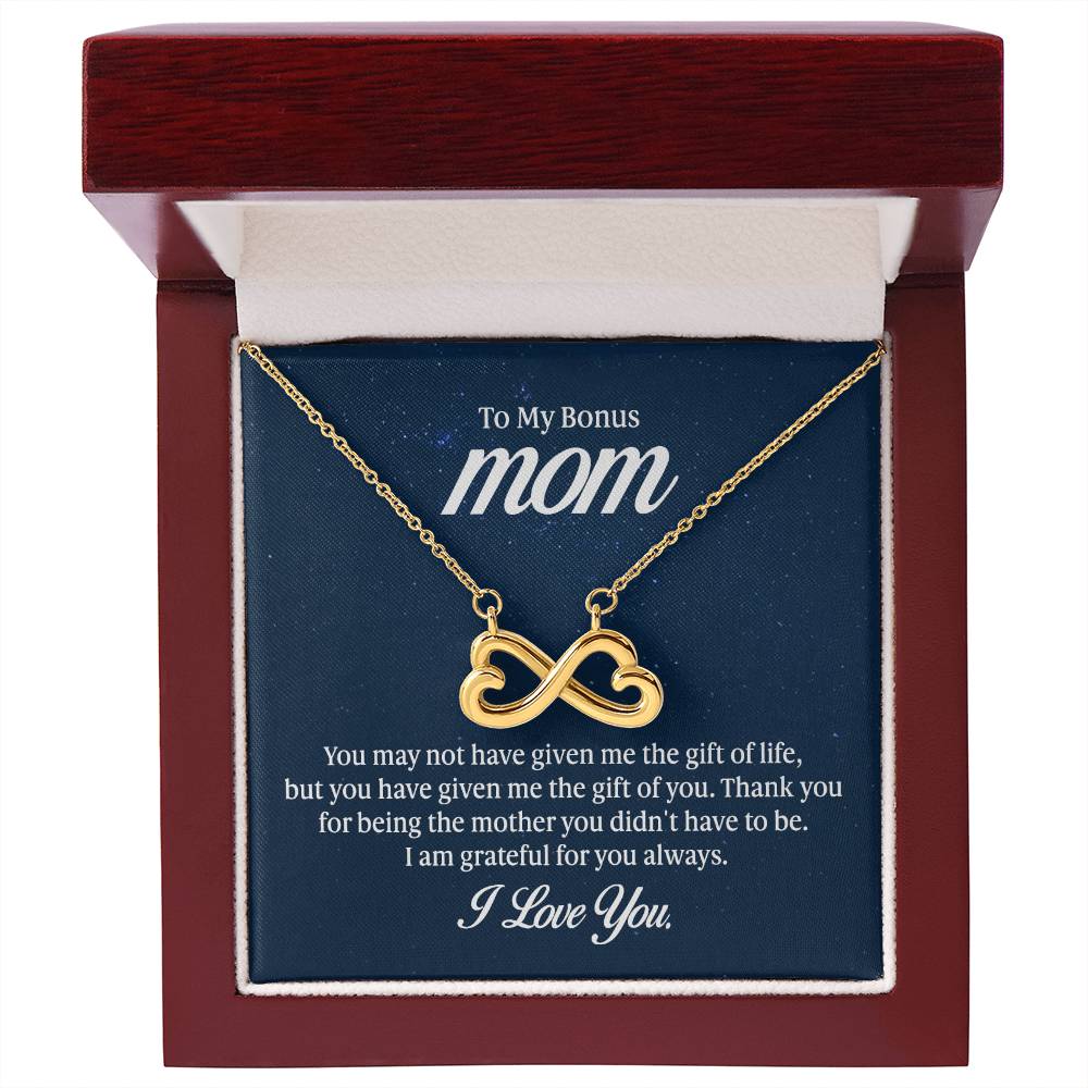Endless Love Necklace on a gift card, showcasing a heart-shaped infinity symbol in 18k yellow gold finish, artisan-crafted and hand-polished.