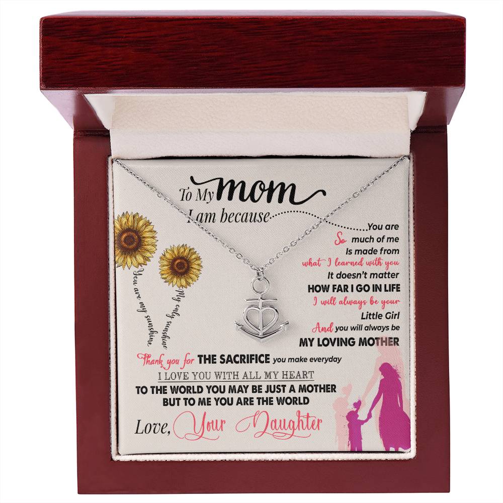 gift card with a combination heart and ship anchor pendant necklace Material is stainless steel in a mahogany box