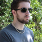 Man wearing a cuban Link Chain made from 14K Yellow Gold Finish over stainless steel