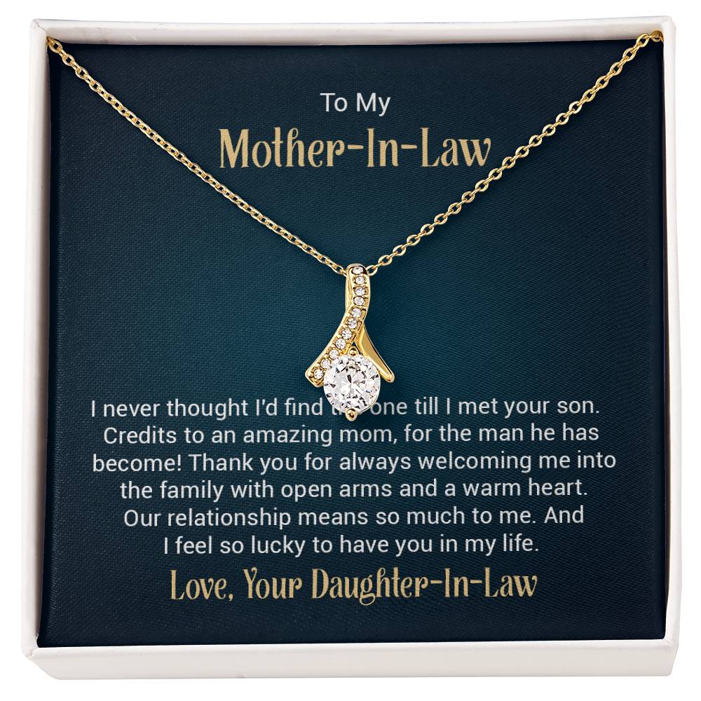Necklace on a gift card, showcasing a 7mm cubic zirconia pendant in 18k yellow gold finish over stainless steel, with pendant dimensions of 0.8 inches in height and 0.4 inches in width, adjustable chain length from 18 to 22 inches, and a lobster clasp.