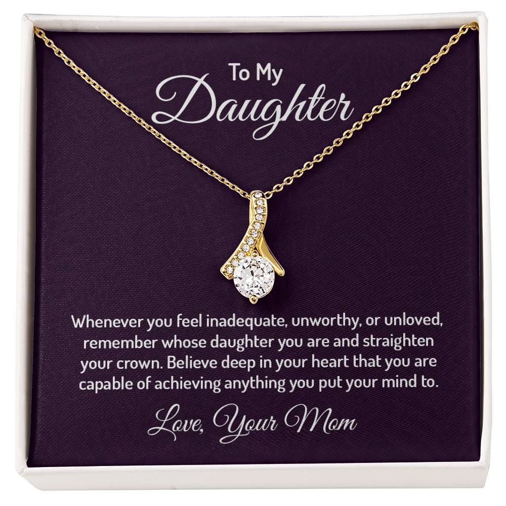 Alluring Beauty necklace features a petite ribbon shaped pendant that is sure to dazzle your special someone. Whether it's a birthday or anniversary, make sure to get her a gift she will love for years to come.