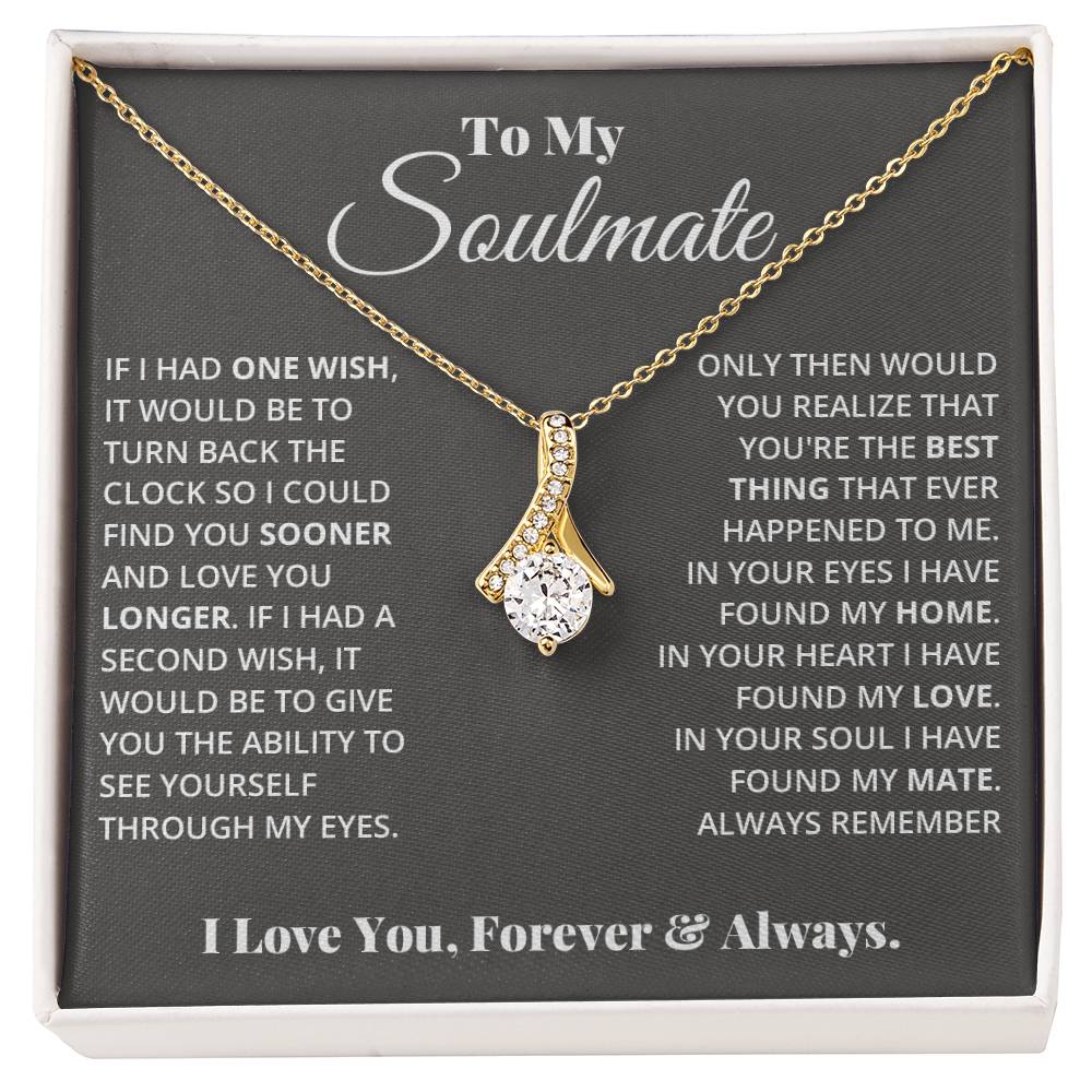 Jewelry card gift with a necklace on it, the necklace is a single pendant with a large cubit zirconia suspended by a curved bar with smaller cubit zirconia