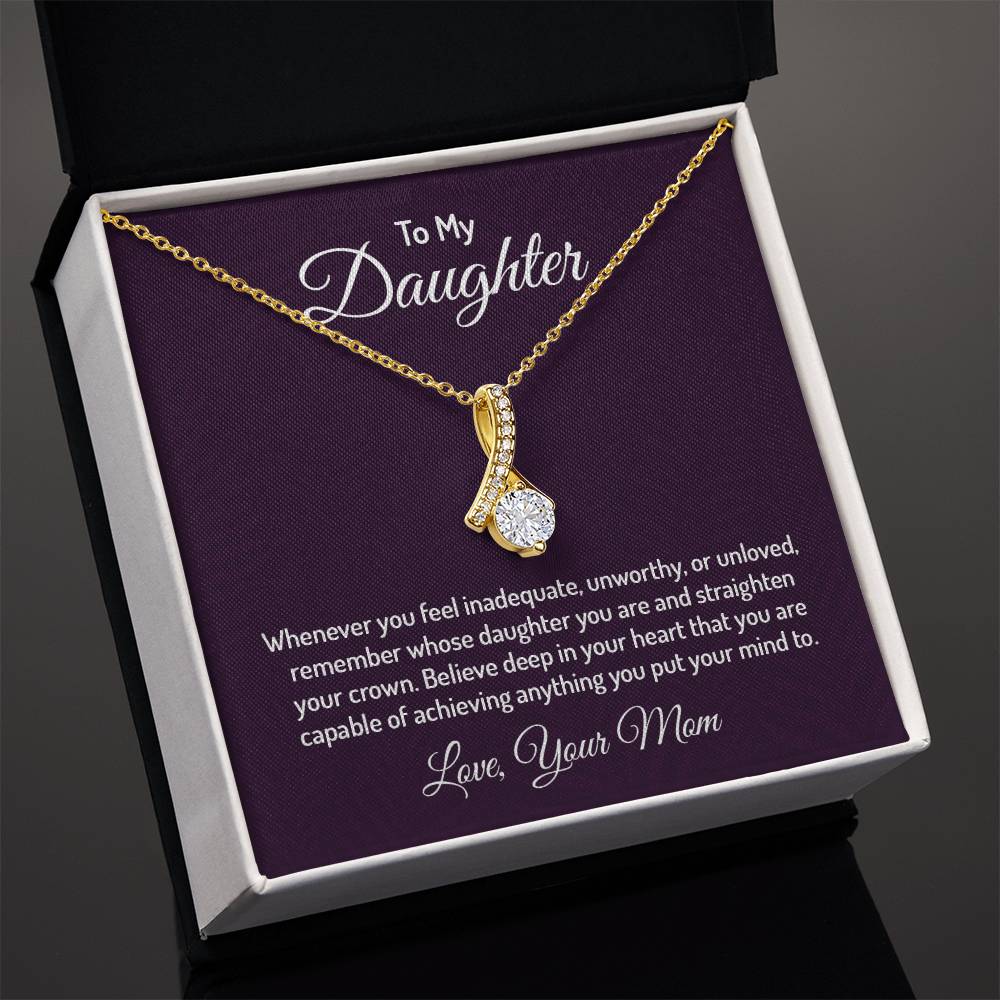 Alluring Beauty necklace features a petite ribbon shaped pendant that is sure to dazzle your special someone. Whether it's a birthday or anniversary, make sure to get her a gift she will love for years to come.