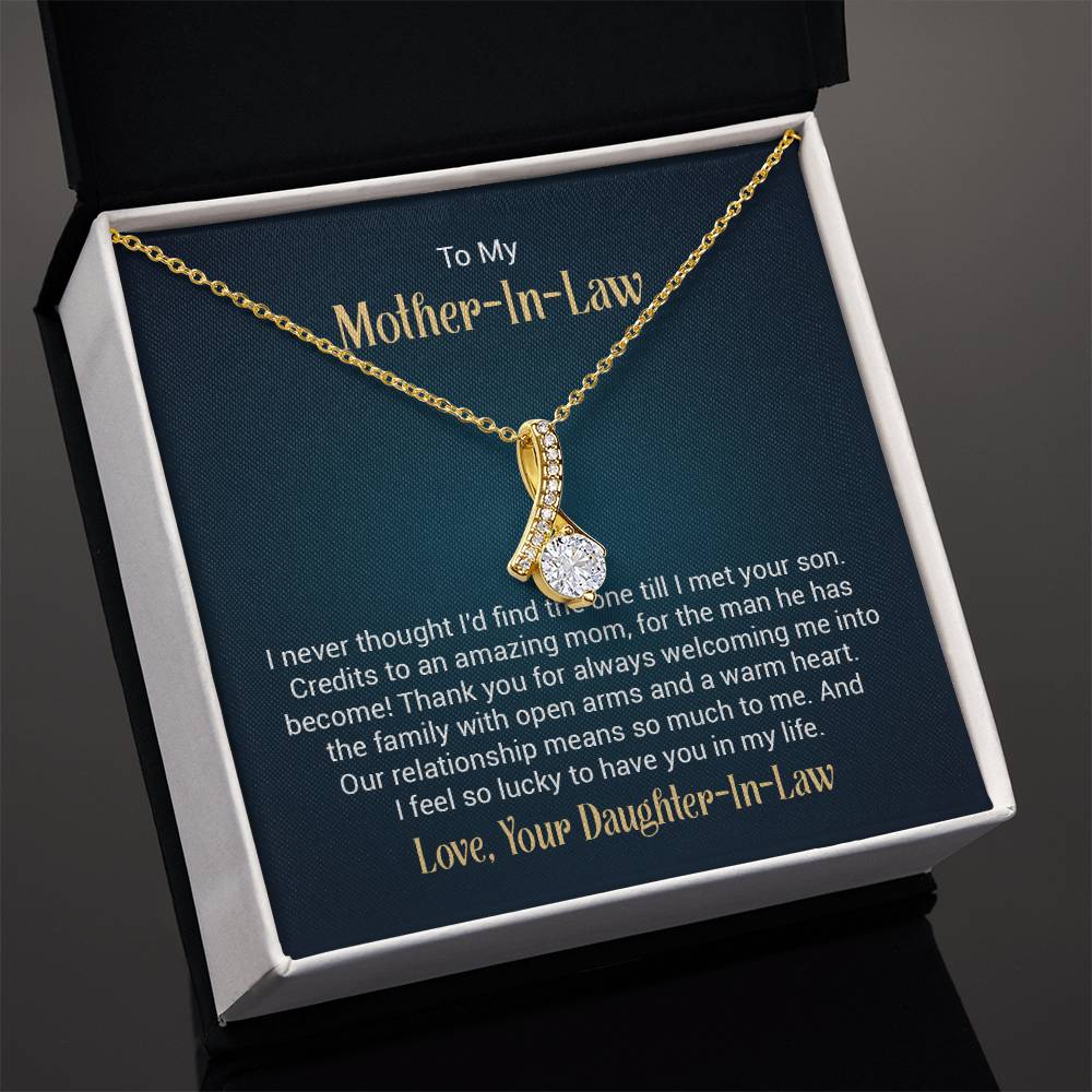 Necklace on a gift card, showcasing a 7mm cubic zirconia pendant in 18k yellow gold finish over stainless steel, with pendant dimensions of 0.8 inches in height and 0.4 inches in width, adjustable chain length from 18 to 22 inches, and a lobster clasp.