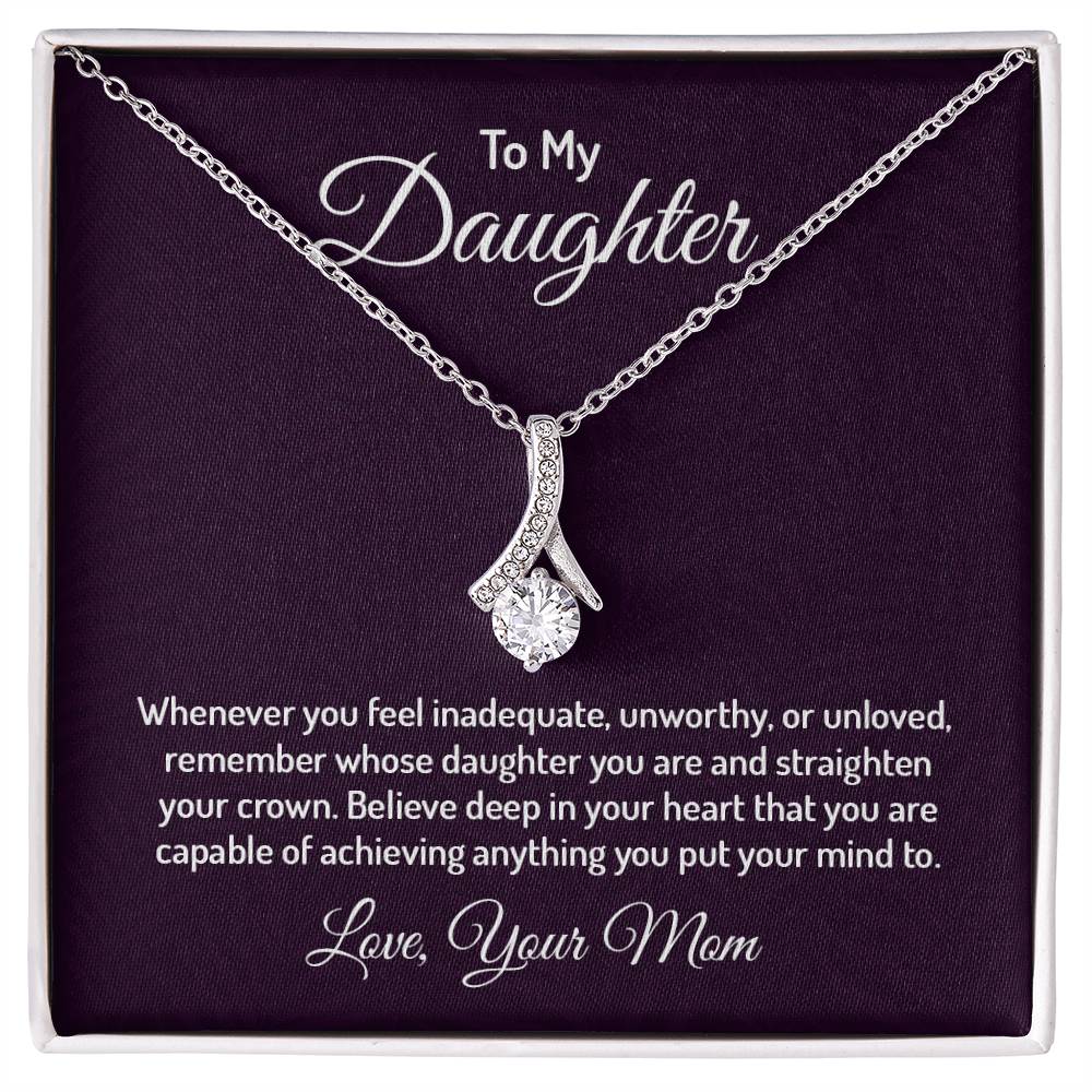 Alluring Beauty necklace features a petite ribbon shaped pendant that is sure to dazzle your special someone. Whether it's a birthday or anniversary, make sure to get her a gift she will love for years to come.