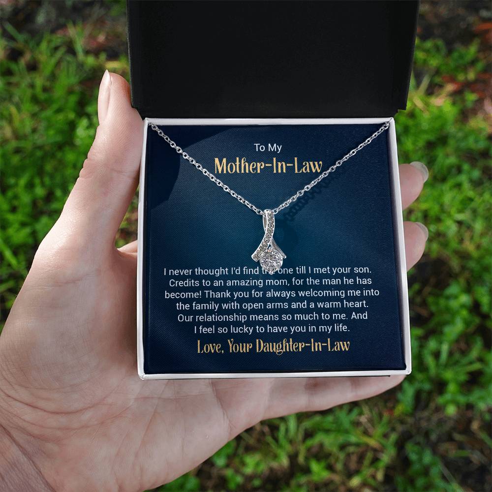 Gift card with a necklace featuring a 7mm cubic zirconia pendant in 14k white gold finish over stainless steel, pendant dimensions 0.8 inches in height and 0.4 inches in width, adjustable chain length of 18 to 22 inches, with a lobster clasp.