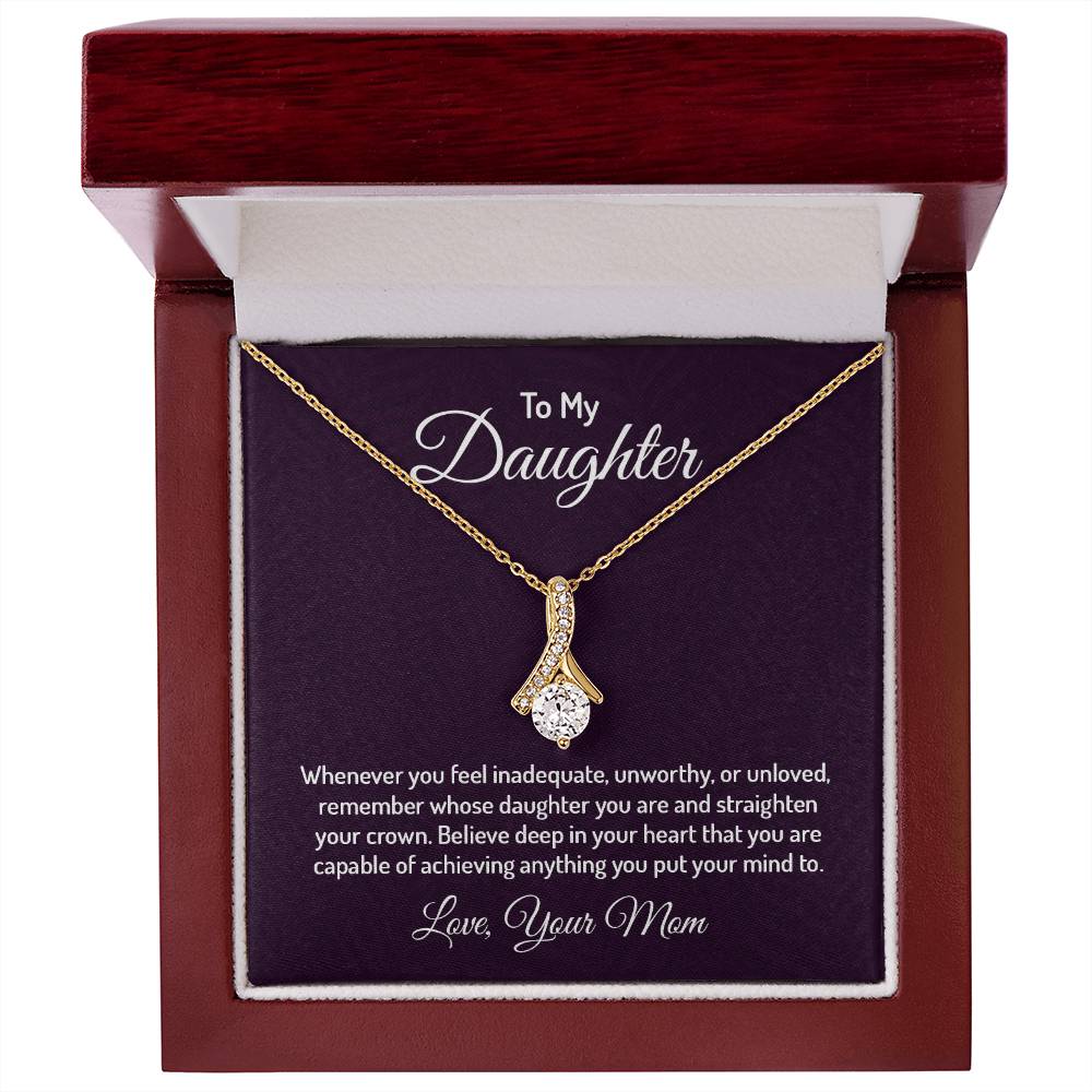 Alluring Beauty necklace features a petite ribbon shaped pendant that is sure to dazzle your special someone. Whether it's a birthday or anniversary, make sure to get her a gift she will love for years to come.