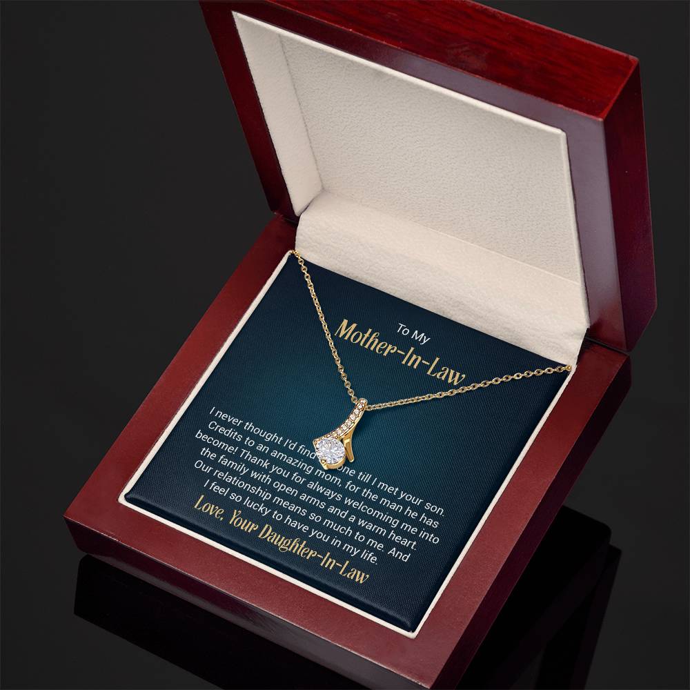 Necklace on a gift card, showcasing a 7mm cubic zirconia pendant in 18k yellow gold finish over stainless steel, with pendant dimensions of 0.8 inches in height and 0.4 inches in width, adjustable chain length from 18 to 22 inches, and a lobster clasp.
