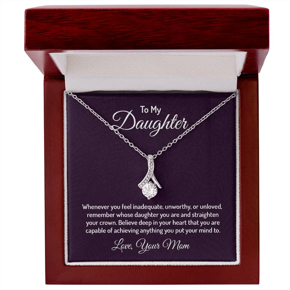 Alluring Beauty necklace features a petite ribbon shaped pendant that is sure to dazzle your special someone. Whether it's a birthday or anniversary, make sure to get her a gift she will love for years to come.