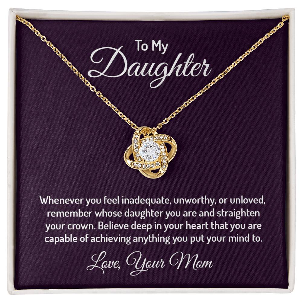 Gorgeous Love Knot Necklace with a pendant adorned with cubic zirconia crystals, available in 14k white gold or 18k yellow gold over stainless steel, adjustable from 18 to 22 inches.
