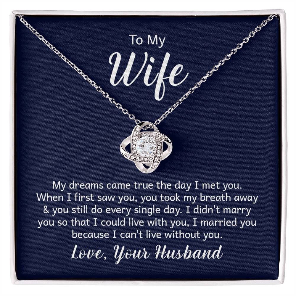 Gift card with a 14k white gold over stainless steel love knot necklace, featuring a 6mm round cut cubic zirconia stone and adjustable chain length of 18 to 22 inches.