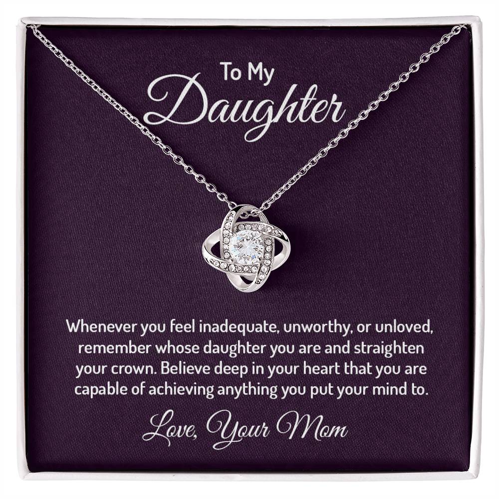 Gorgeous Love Knot Necklace with a pendant adorned with cubic zirconia crystals, available in 14k white gold or 18k yellow gold over stainless steel, adjustable from 18 to 22 inches.