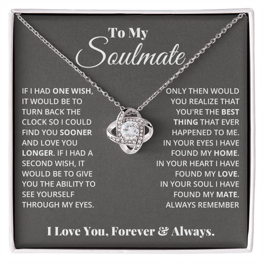 gift card with a Love knot pendant necklace with 2 rings around a large cubit zirconia diamond and 2 interlocking rings with smaller cubit zirconia on them both