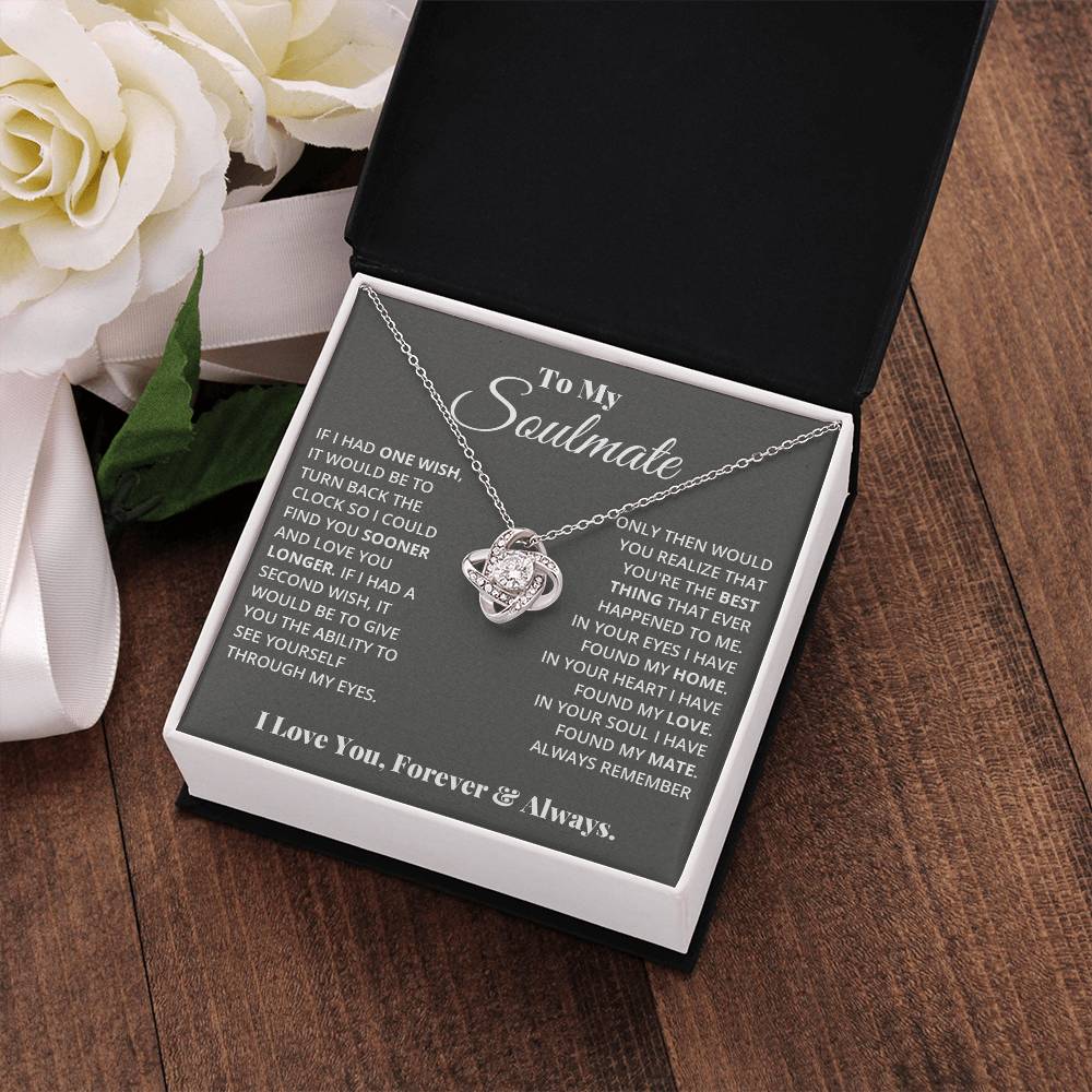 gift card with a Love knot pendant necklace with 2 rings around a large cubit zirconia diamond and 2 interlocking rings with smaller cubit zirconia on them both