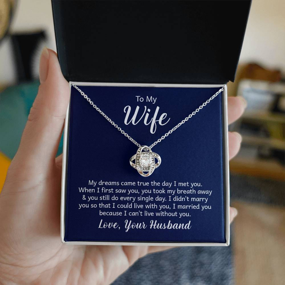 "Gift card with a 14k white gold over stainless steel love knot necklace, featuring a 6mm round cut cubic zirconia stone and adjustable chain length of 18 to 22 inches."