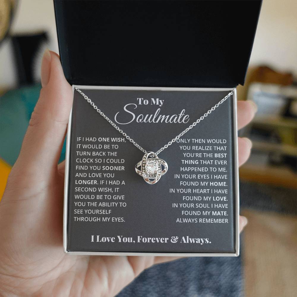 gift card with a Love knot pendant necklace with 2 rings around a large cubit zirconia diamond and 2 interlocking rings with smaller cubit zirconia on them both