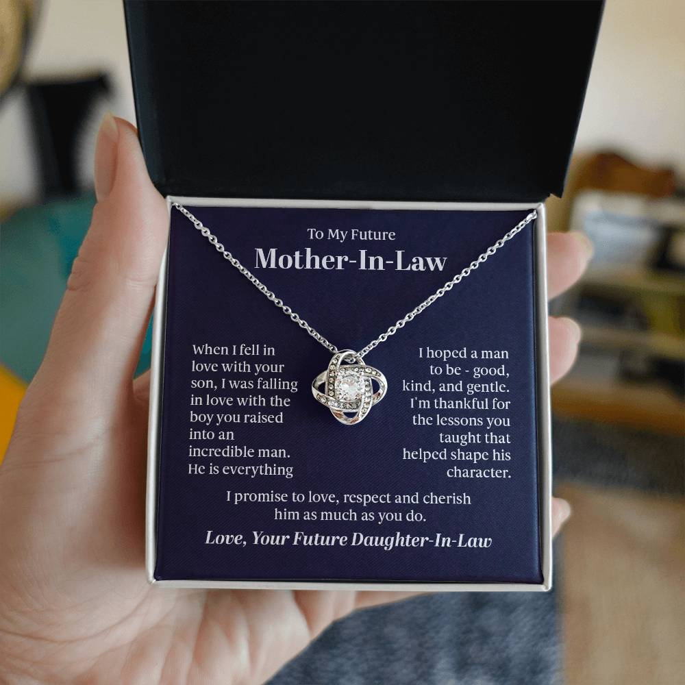 Elegant Love Knot Necklace with a pendant adorned with premium cubic zirconia crystals, 14k white gold or 18k yellow gold over stainless steel, adjustable from 18 to 22 inches.
