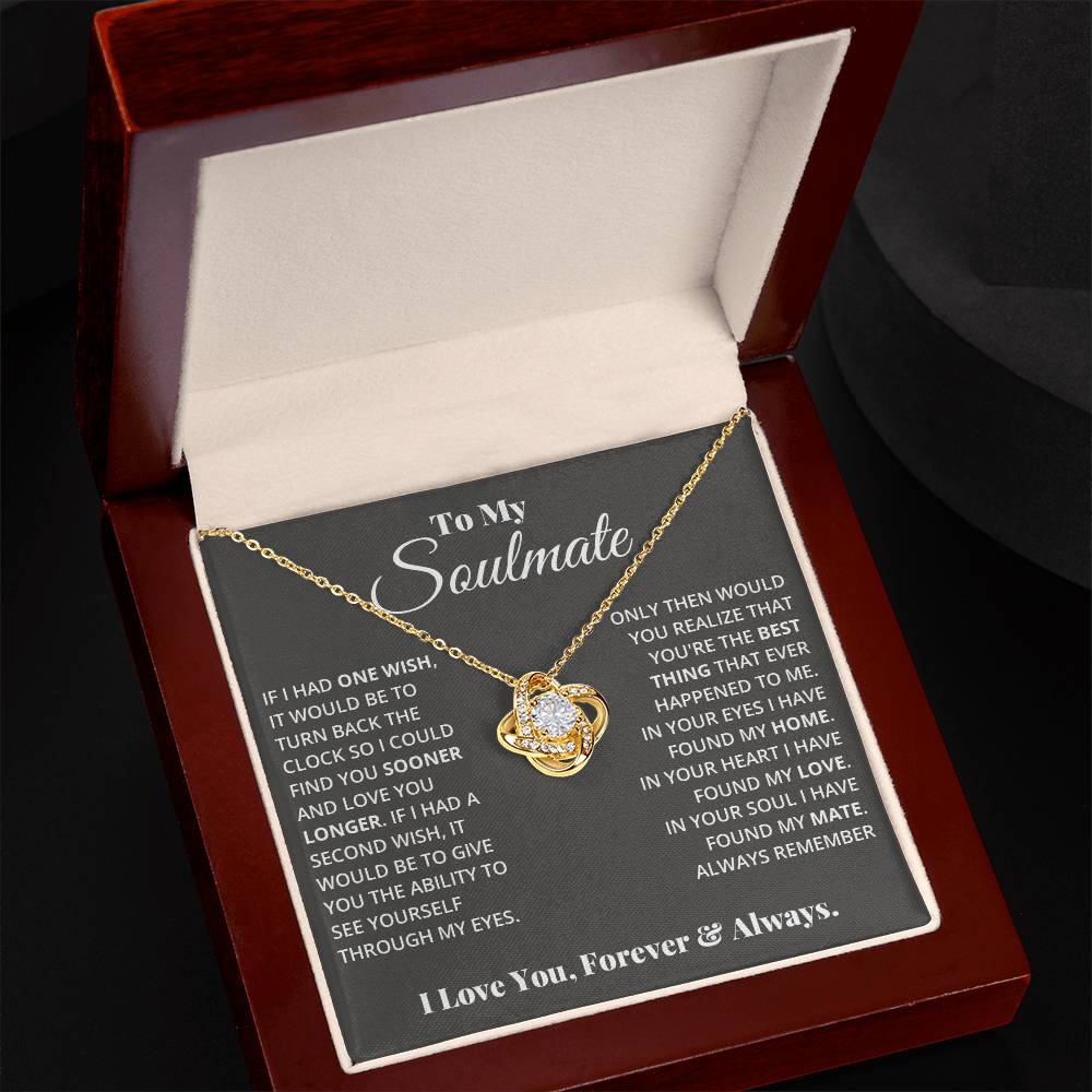 gift card with a Love knot pendant necklace with 2 rings around a large cubit zirconia diamond and 2 interlocking rings with smaller cubit zirconia on them both
