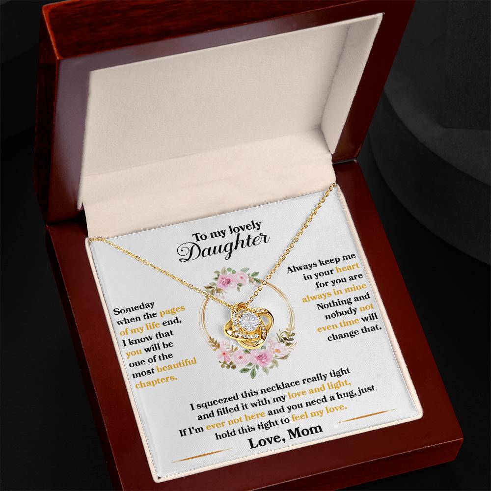 gift card with a 18k yellow gold over stainless steel love knot pendant neckalce