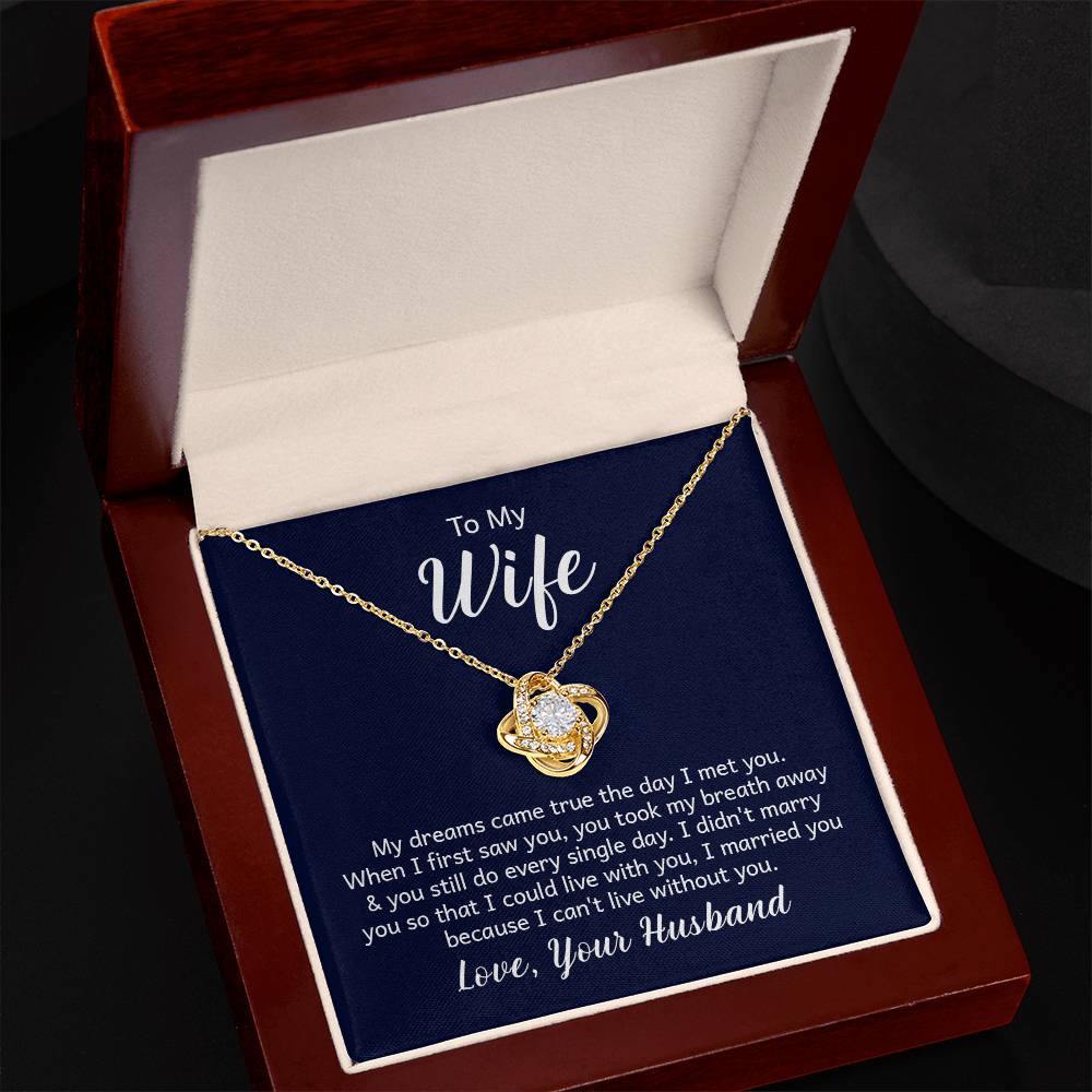 "18k yellow gold over stainless steel love knot necklace on a gift card, showcasing a 6mm round cut cubic zirconia stone and adjustable chain length from 18 to 22 inches."