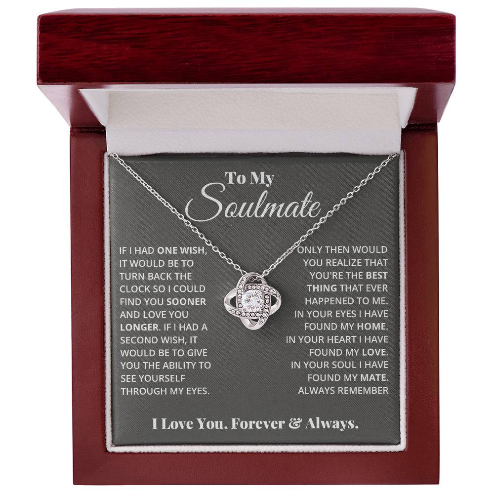 gift card with a Love knot pendant necklace with 2 rings around a large cubit zirconia diamond and 2 interlocking rings with smaller cubit zirconia on them both