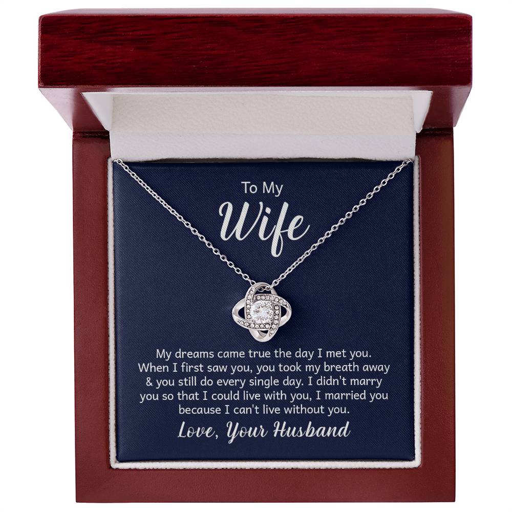 "Gift card with a 14k white gold over stainless steel love knot necklace, featuring a 6mm round cut cubic zirconia stone and adjustable chain length of 18 to 22 inches."
