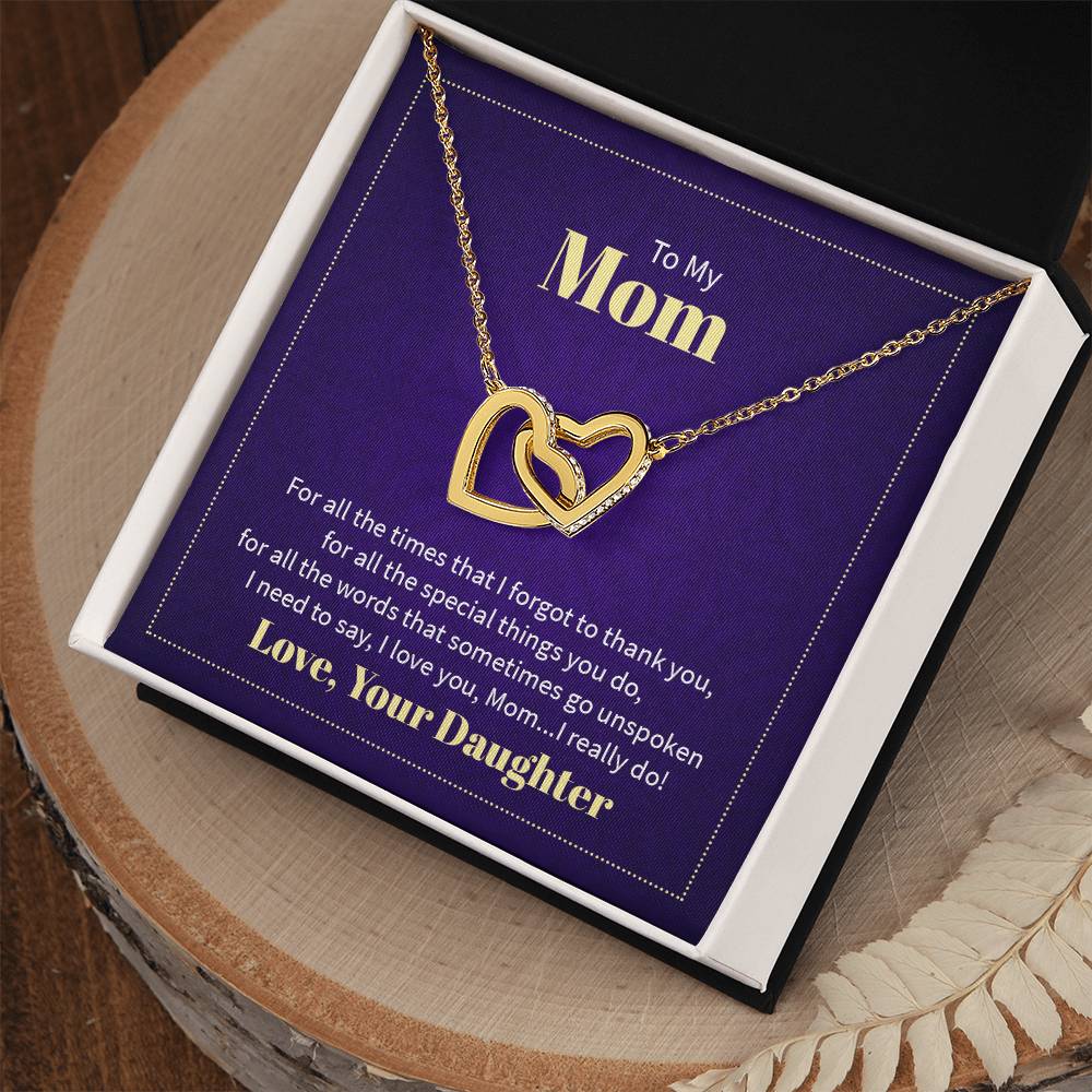 Necklace featuring two heart pendants adorned with CZ crystals, available in polished surgical steel with a rose gold or 18k yellow gold finish, adjustable from 18 to 22 inches.