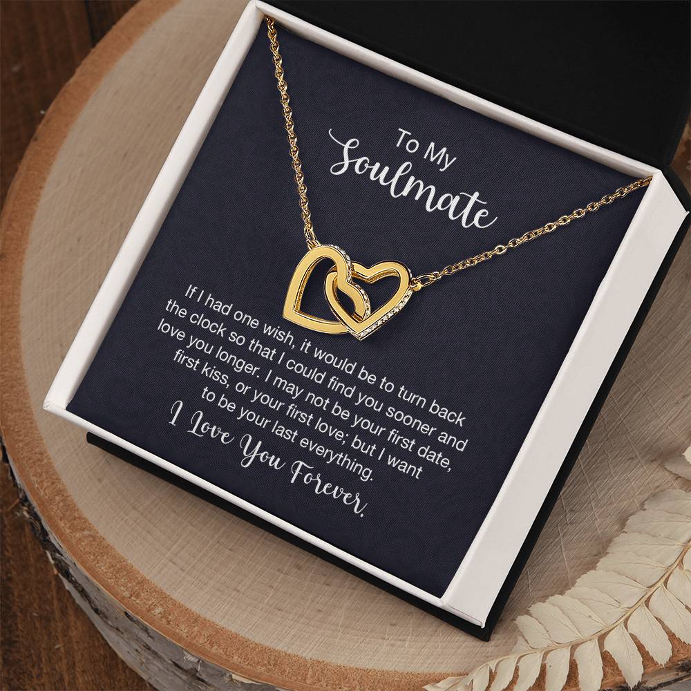 Gift card displaying a necklace with two heart pendants adorned with CZ crystals, featuring an 18k yellow gold finish over high quality polished surgical steel, pendant dimensions 0.6 inches in height and 1.1 inches in width, adjustable chain length from 18 to 22 inches.