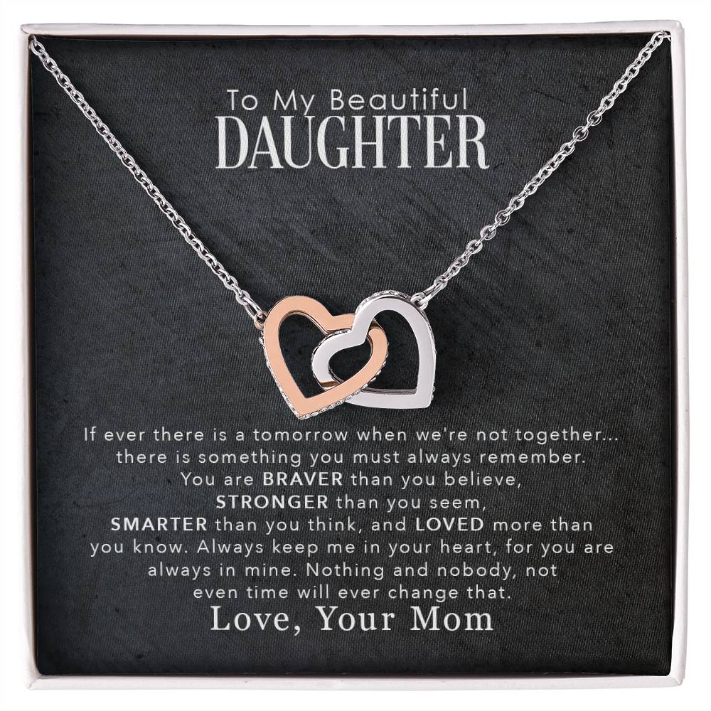 gift card with a necklace with 2 interlocking hearts one stainless steel and one gold finish