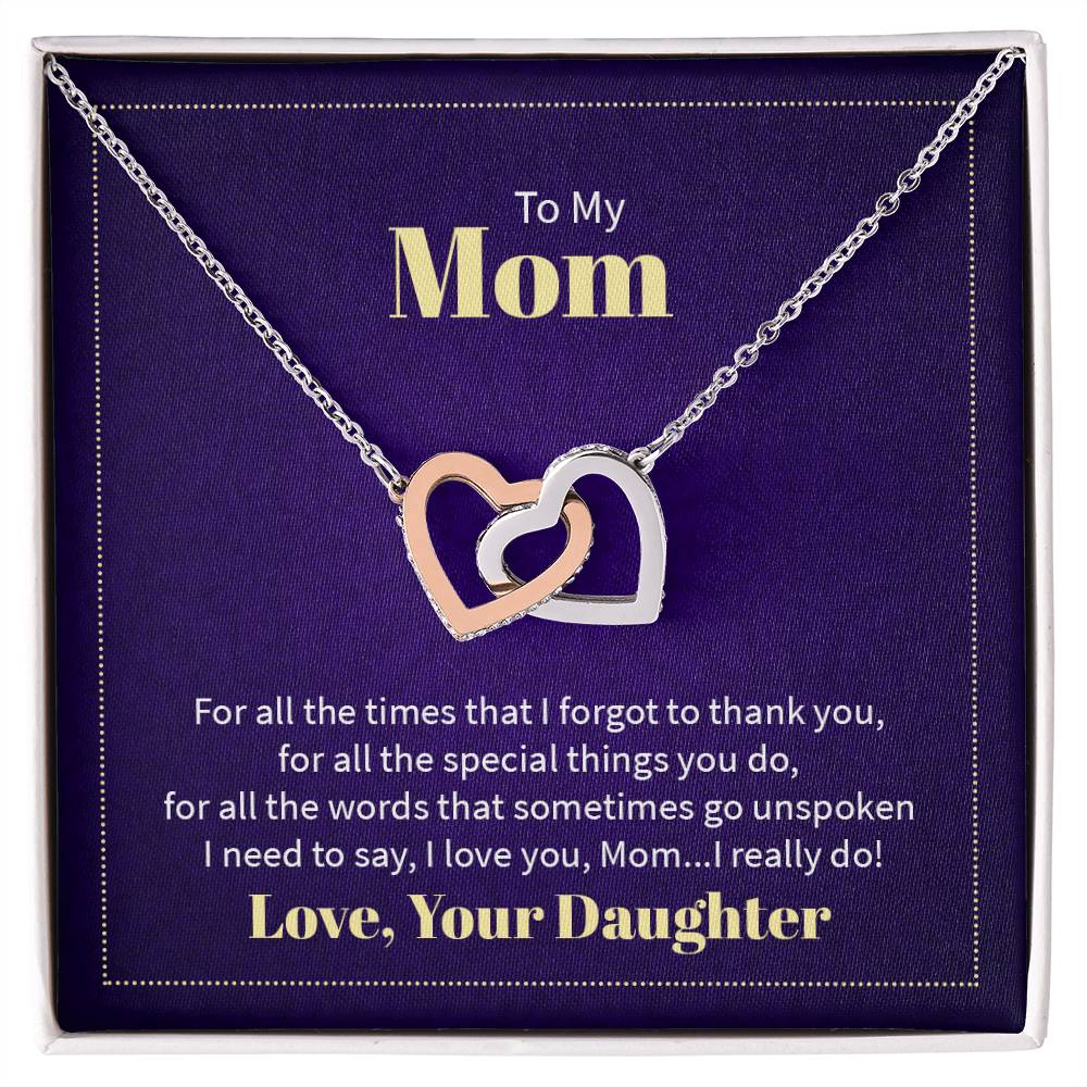 Necklace featuring two heart pendants adorned with CZ crystals, available in polished surgical steel with a rose gold or 18k yellow gold finish, adjustable from 18 to 22 inches.