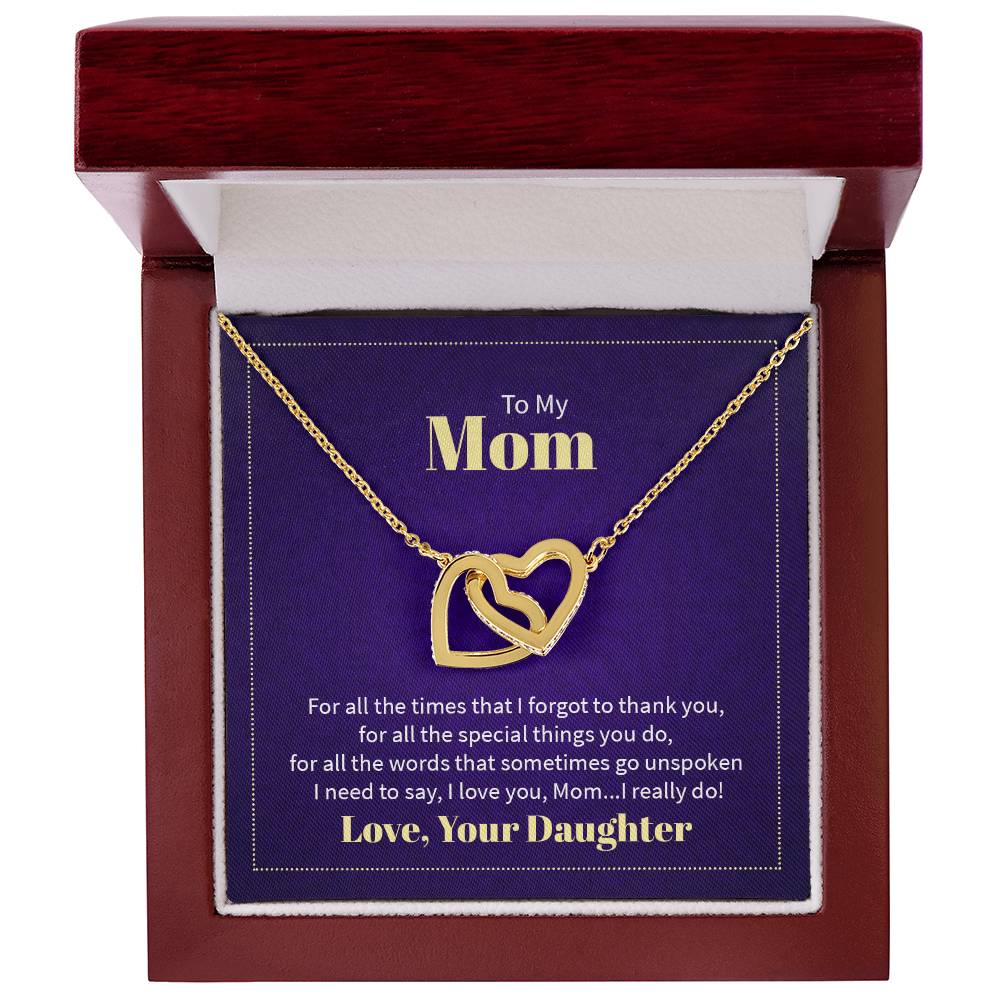 Necklace featuring two heart pendants adorned with CZ crystals, available in polished surgical steel with a rose gold or 18k yellow gold finish, adjustable from 18 to 22 inches.