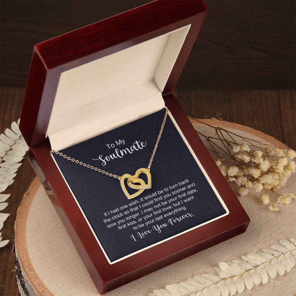 Gift card displaying a necklace with two heart pendants adorned with CZ crystals, featuring an 18k yellow gold finish over high quality polished surgical steel, pendant dimensions 0.6 inches in height and 1.1 inches in width, adjustable chain length from 18 to 22 inches.