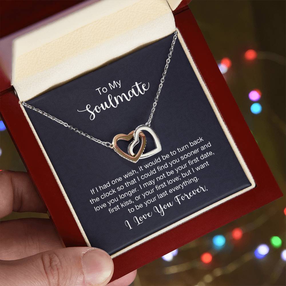 Gift card with two heart pendants embellished with CZ crystals, featuring high quality polished surgical steel and rose gold finish, pendant dimensions 0.6 inches in height and 1.1 inches in width, adjustable chain length of 18 to 22 inches.