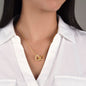 Woman wearing a necklace featuring two heart pendants adorned with CZ crystals, available in polished surgical steel with a rose gold or 18k yellow gold finish, adjustable from 18 to 22 inches.