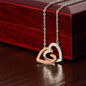 Necklace featuring two heart pendants adorned with CZ crystals, available in polished surgical steel with a rose gold or 18k yellow gold finish, adjustable from 18 to 22 inches.