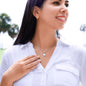 bEautiful young womand wearing an Eternal Hope Necklace features a center cushion cut cubic zirconia that will sparkle with every step. The center crystal is adorned with equally brilliant CZ crystals, ensuring a stunning look