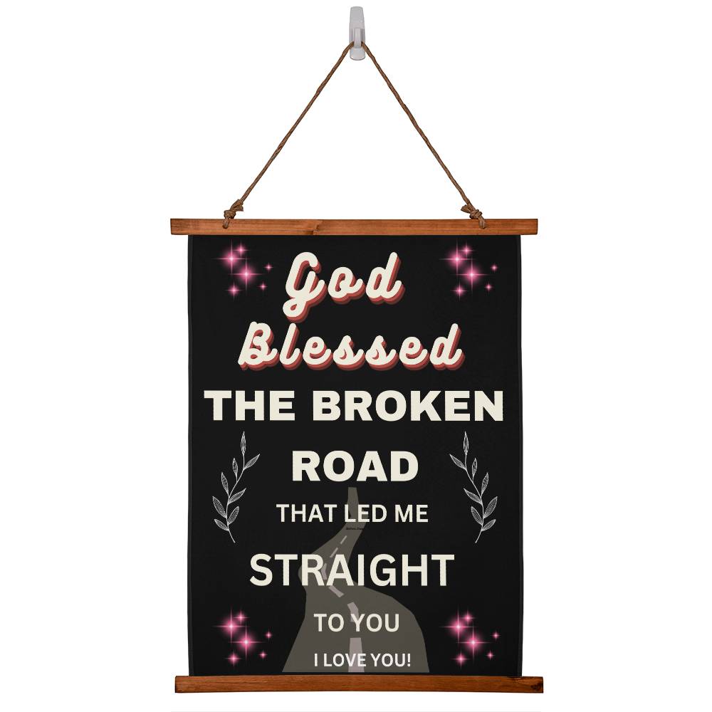 Hanging wall canvas with quote onit God blessed teh broken road that led me straight to you