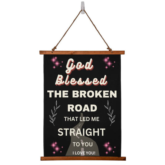 Hanging wall canvas with quote onit God blessed teh broken road that led me straight to you