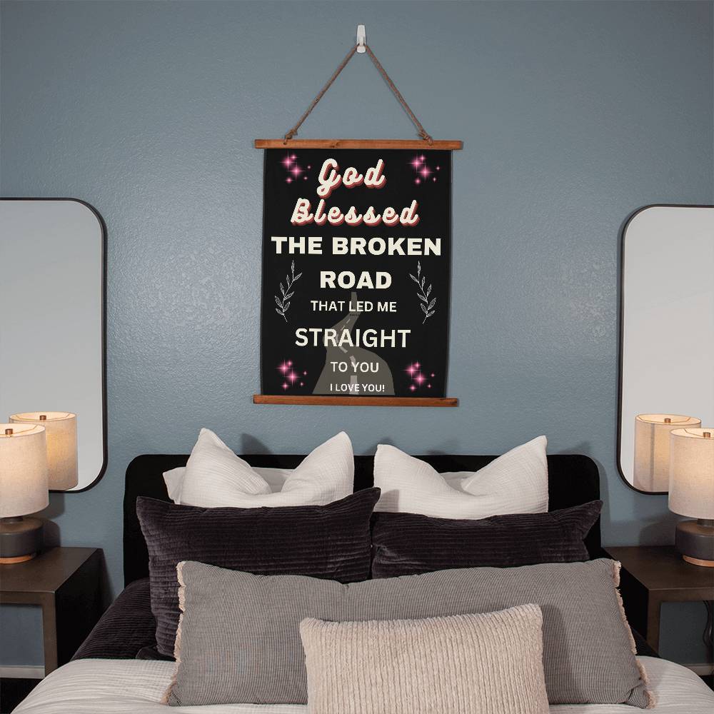 Hanging wall canvas with quote onit God blessed teh broken road that led me straight to you