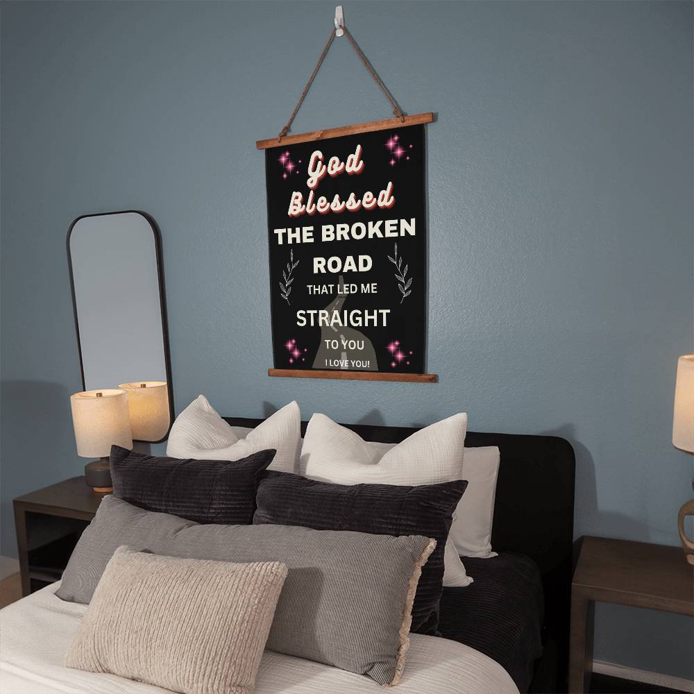 Hanging wall canvas with quote onit God blessed teh broken road that led me straight to you