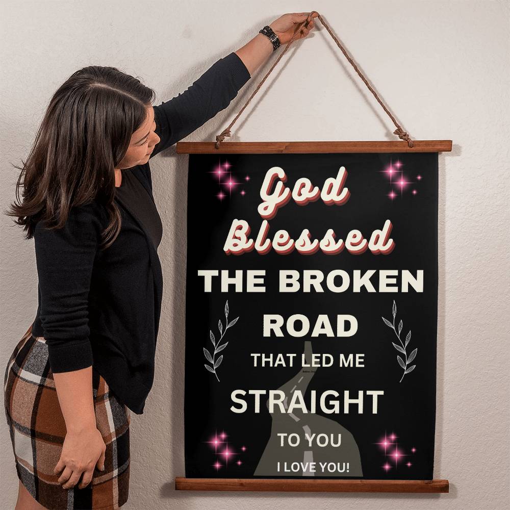 Hanging wall canvas with quote onit God blessed teh broken road that led me straight to you