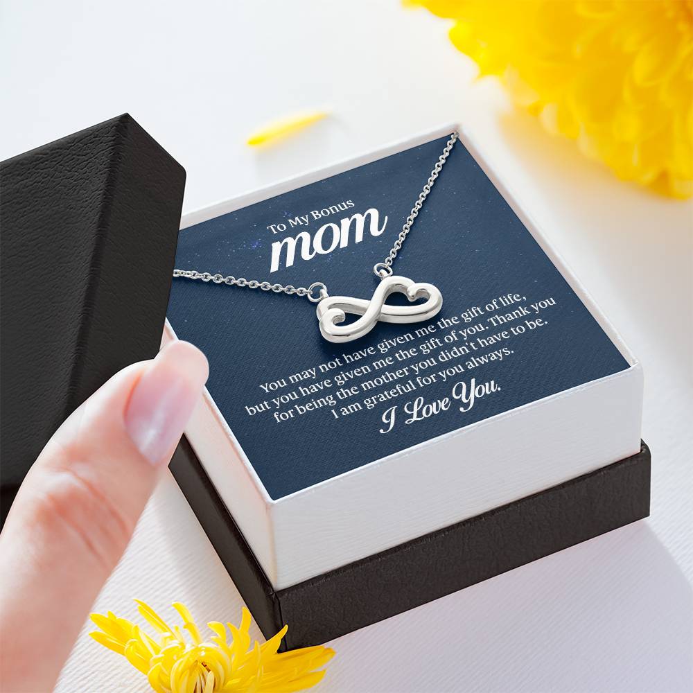Gift card with the Endless Love Necklace, featuring a heart-shaped infinity symbol crafted in 14k white gold finish, hand-polished for a magnificent shine