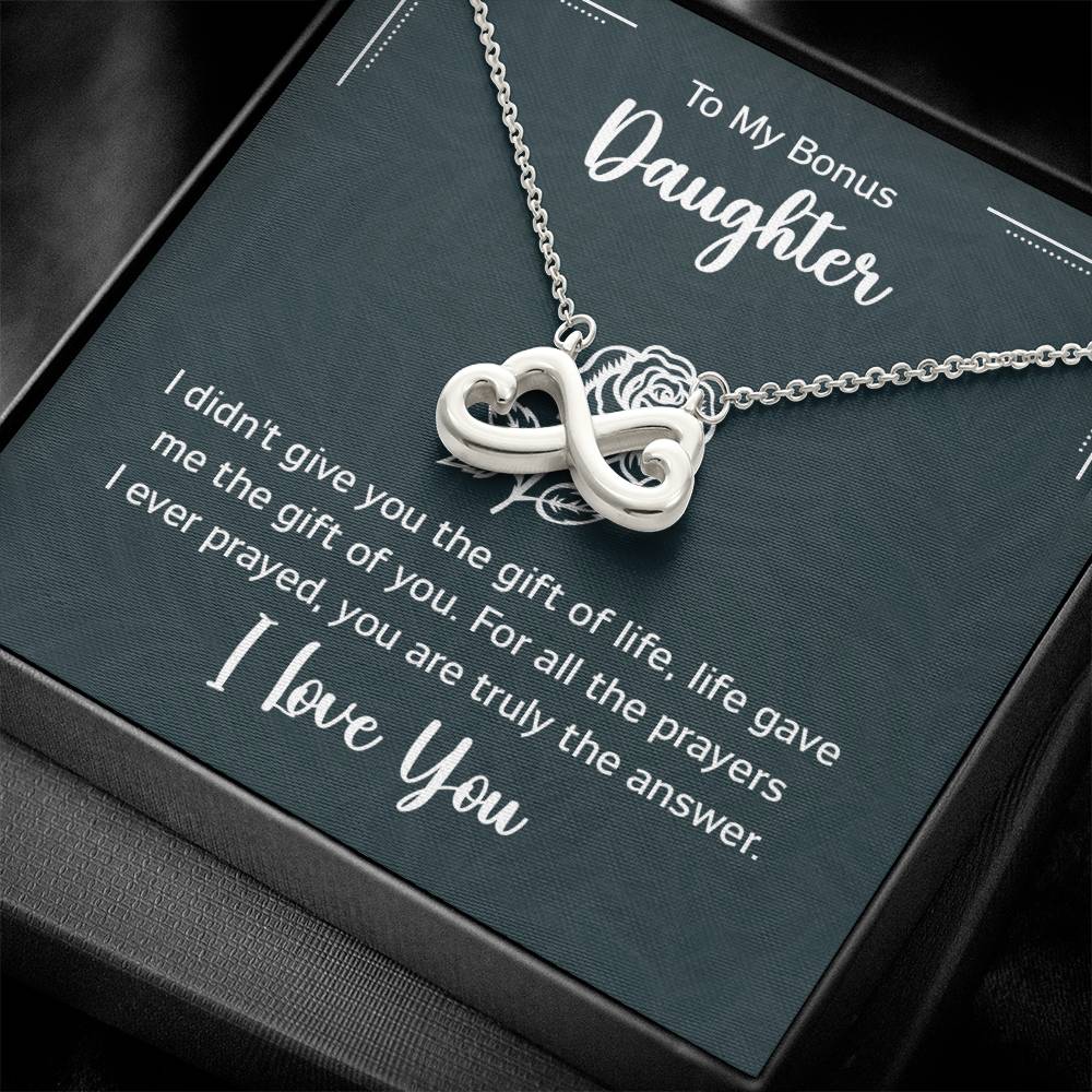 Gift box with a heart pendant necklace on It. 14k white gold finish or 18k yellow gold finish 6.5mm round cut cubic zirconia stone Pendant dimensions: 0.8" (2.2cm) height / 0.7" (1.8cm) width Adjustable chain length: 18" - 22" (45.72cm - 55.88cm) Lobster clasp attachment