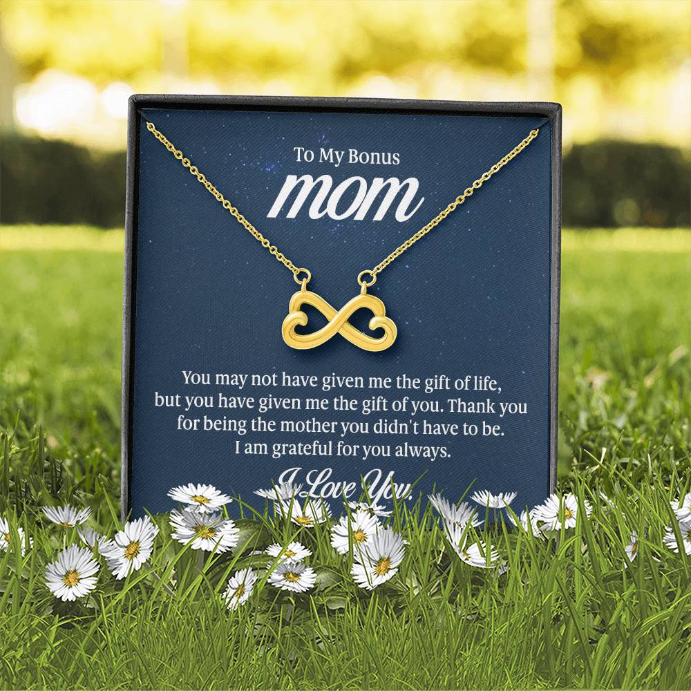 Endless Love Necklace on a gift card, showcasing a heart-shaped infinity symbol in 18k yellow gold finish, artisan-crafted and hand-polished.