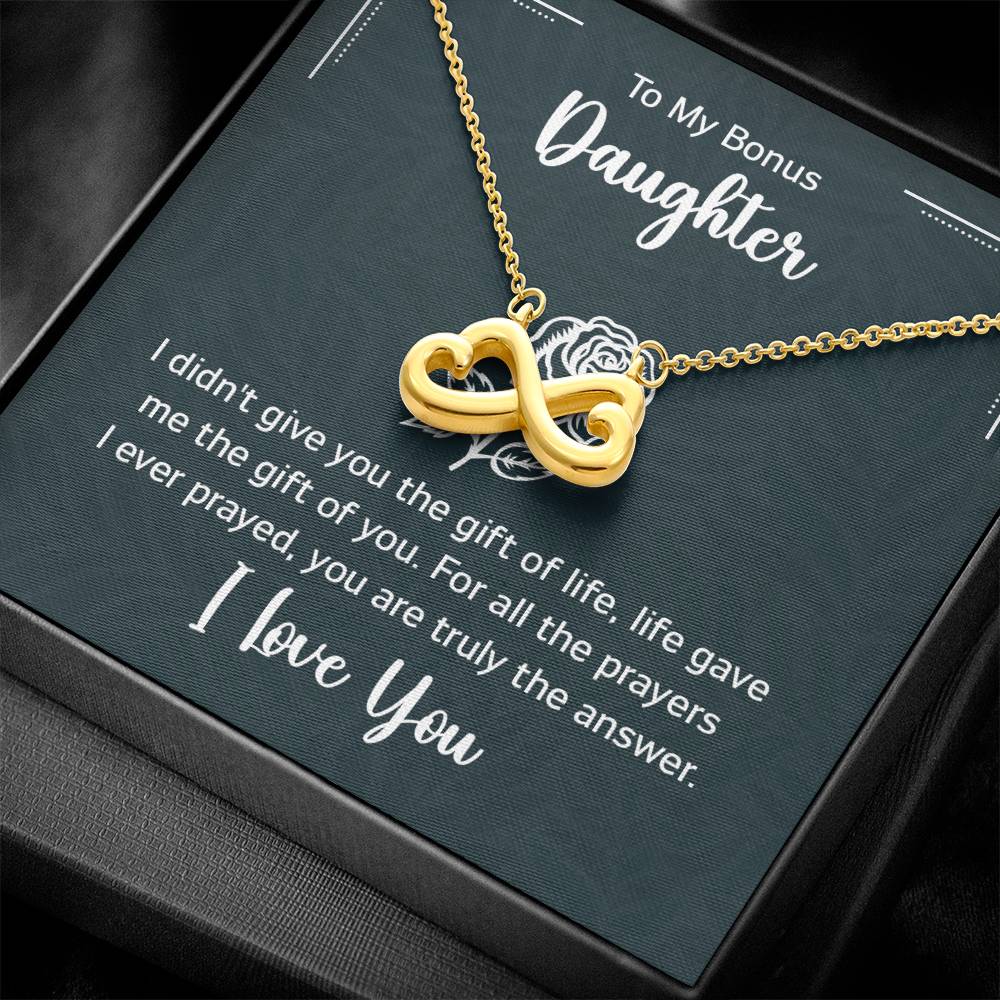 Gift box with a heart pendant necklace on It. 14k white gold finish or 18k yellow gold finish 6.5mm round cut cubic zirconia stone Pendant dimensions: 0.8" (2.2cm) height / 0.7" (1.8cm) width Adjustable chain length: 18" - 22" (45.72cm - 55.88cm) Lobster clasp attachment