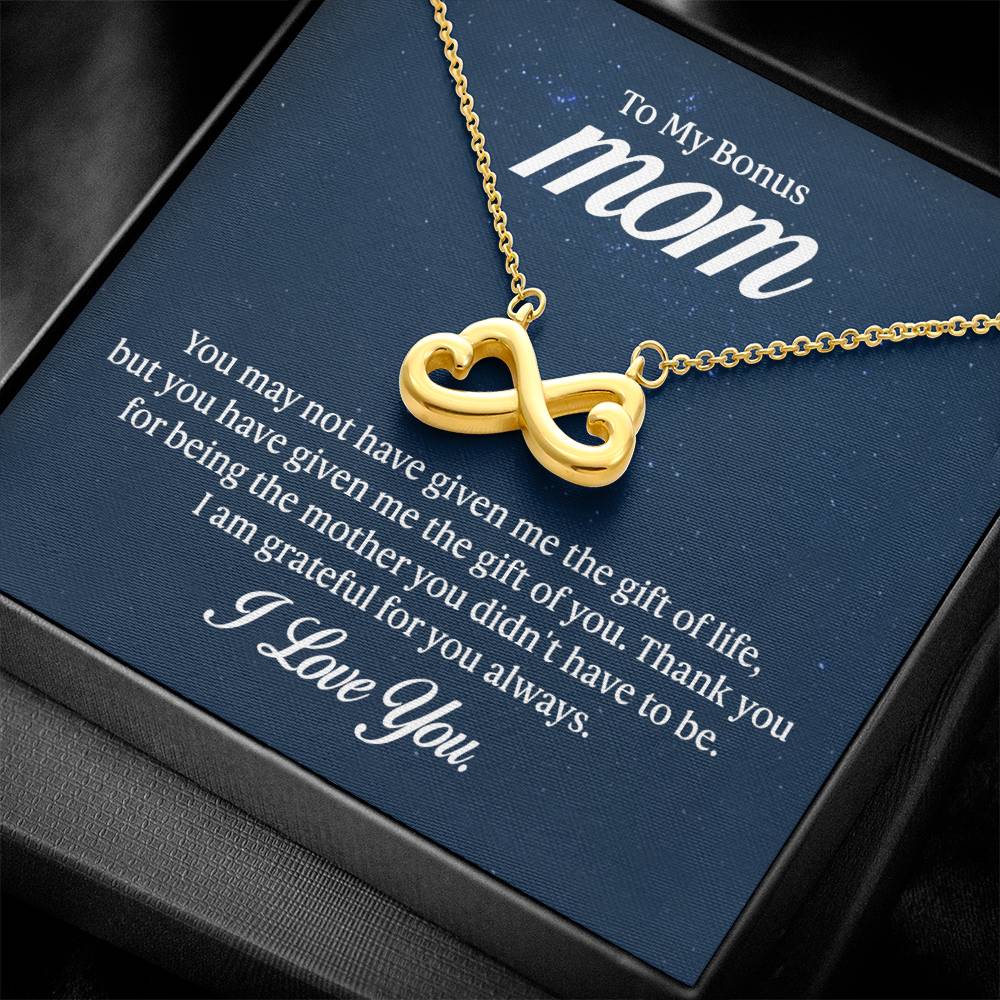Endless Love Necklace on a gift card, showcasing a heart-shaped infinity symbol in 18k yellow gold finish, artisan-crafted and hand-polished.