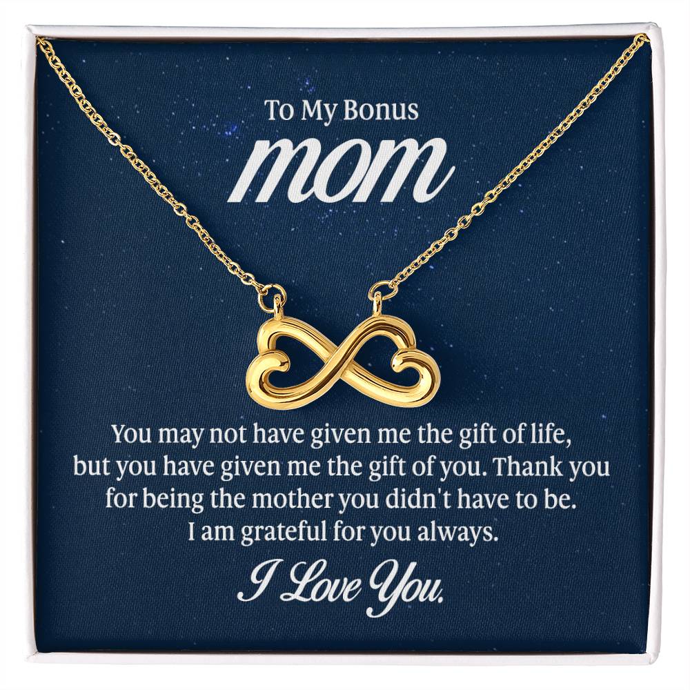 Endless Love Necklace on a gift card, showcasing a heart-shaped infinity symbol in 18k yellow gold finish, artisan-crafted and hand-polished.